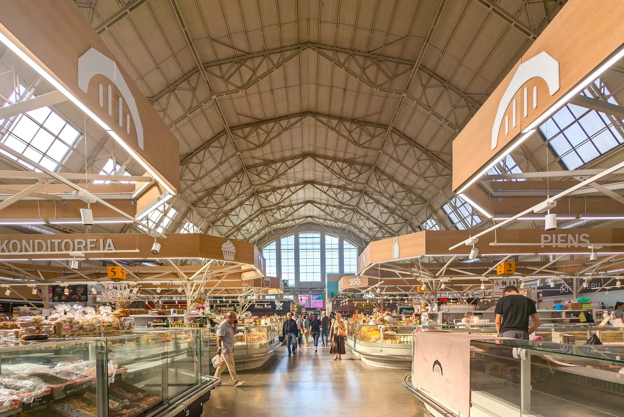 Inside the huge vaulted hall of Riga Central Market, with bread, fish and pickle stalls