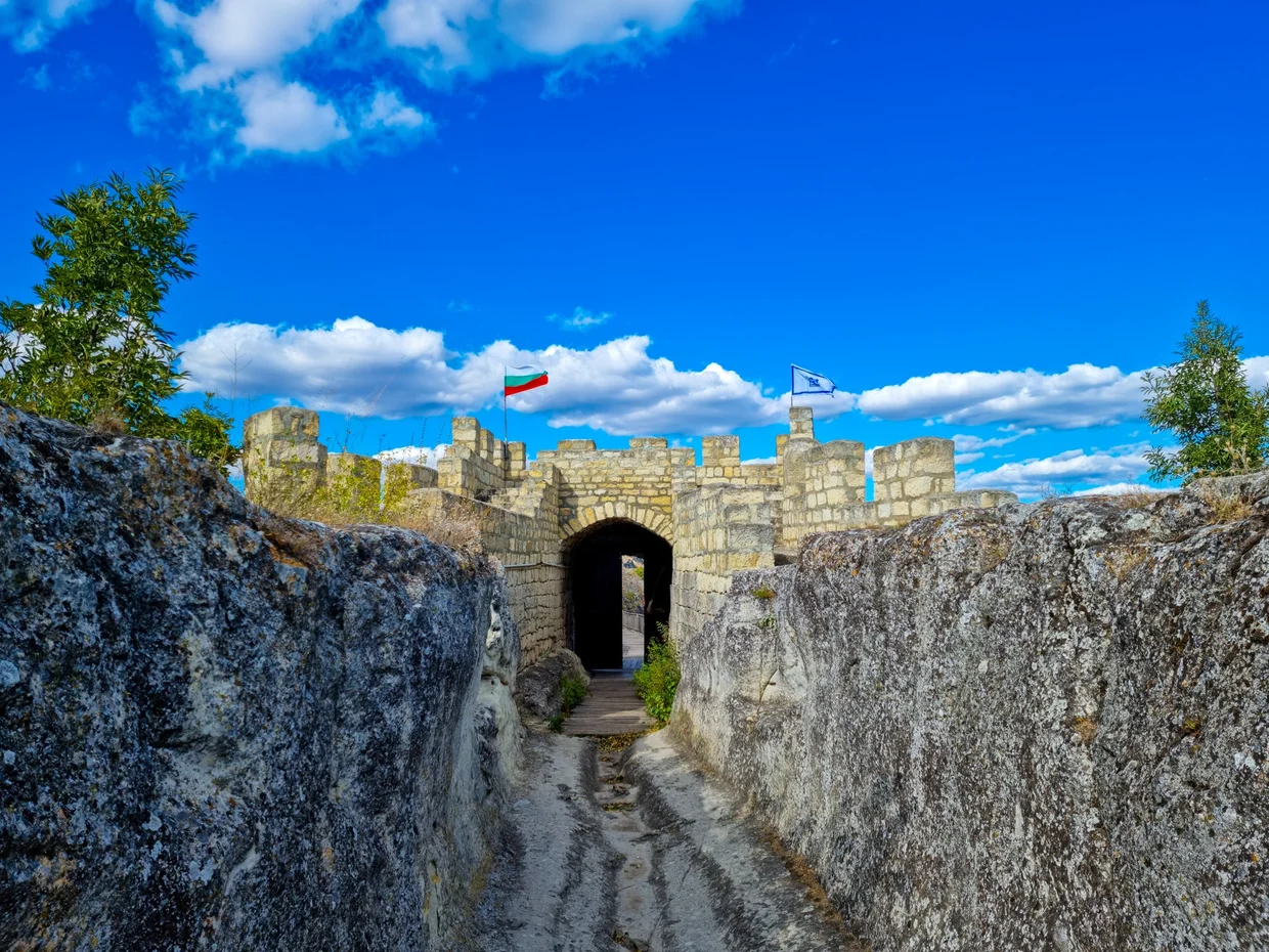 The entrance gate to Ovech Fortress with the Bulgarian flag