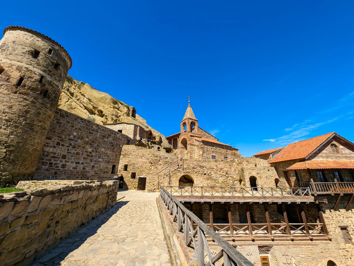 Monastery courtyard with stone bell tower