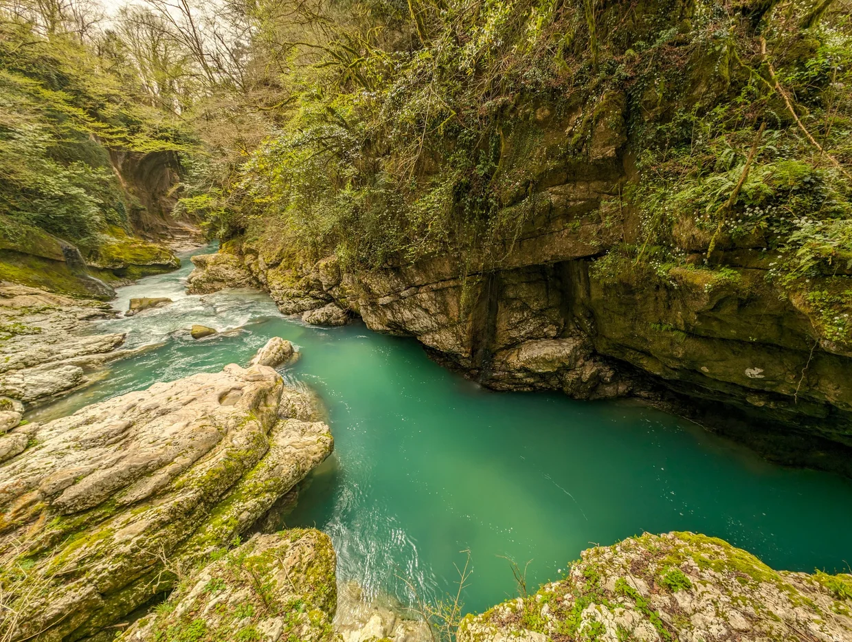 Turquoise pool in the depths of the canyon