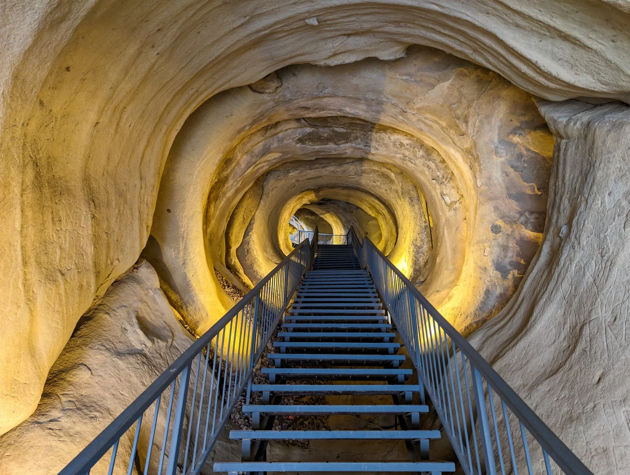 The carved lit stairway inside Uplistsikhe