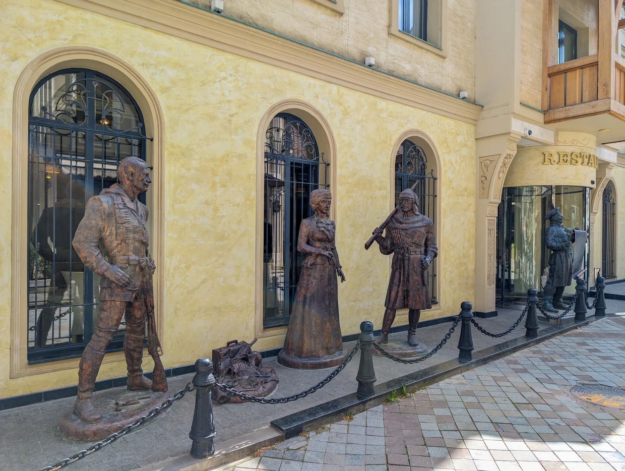 Another view of the Dvornik sculpture tucked into the street scene
