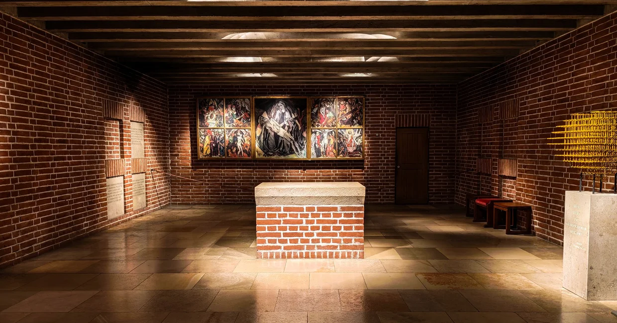 Wittelsbach royal crypt under the Frauenkirche - brick walls, central tomb block, triptych on the back wall