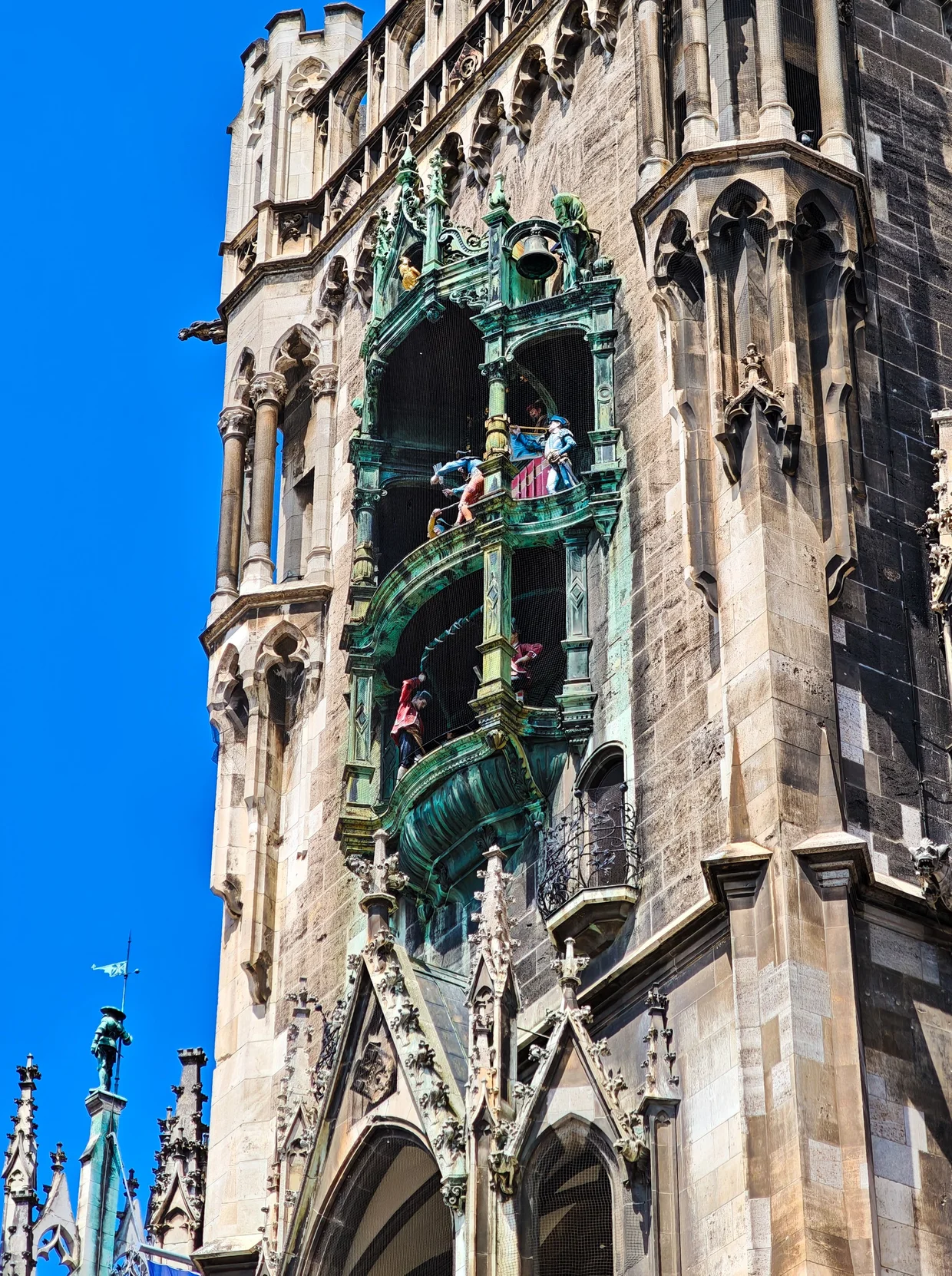 Close-up of the Glockenspiel bronze figures inside their gothic niche