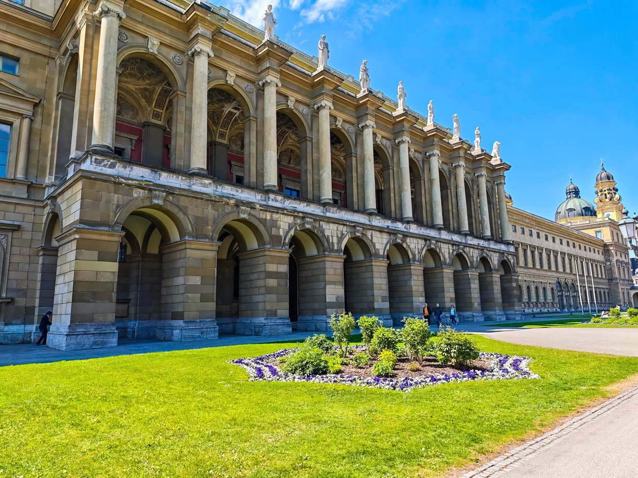 Hofgartenarkaden of the Residenz with the Theatinerkirche dome visible