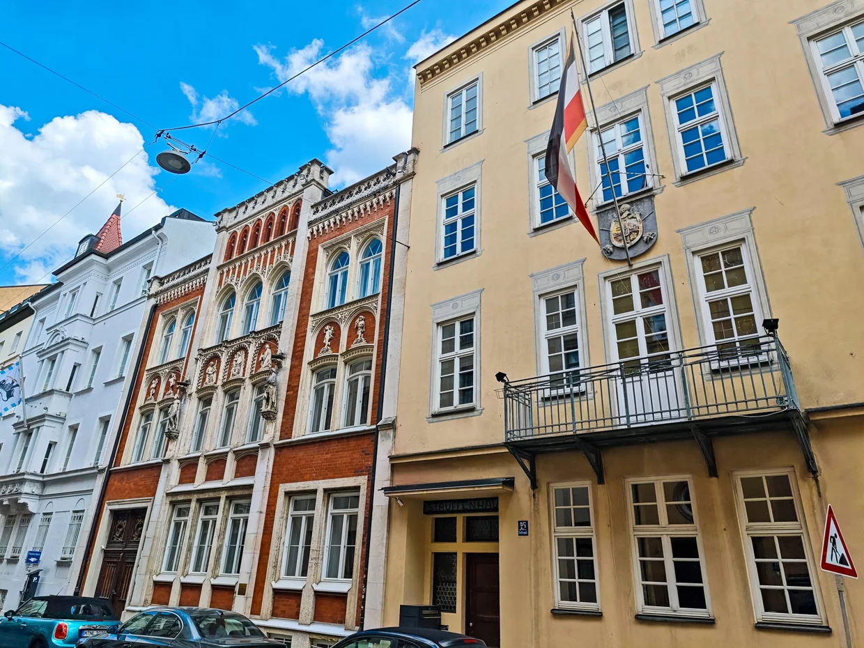 Side street near the Hofbräuhaus with Bavarian-flag-painted facades