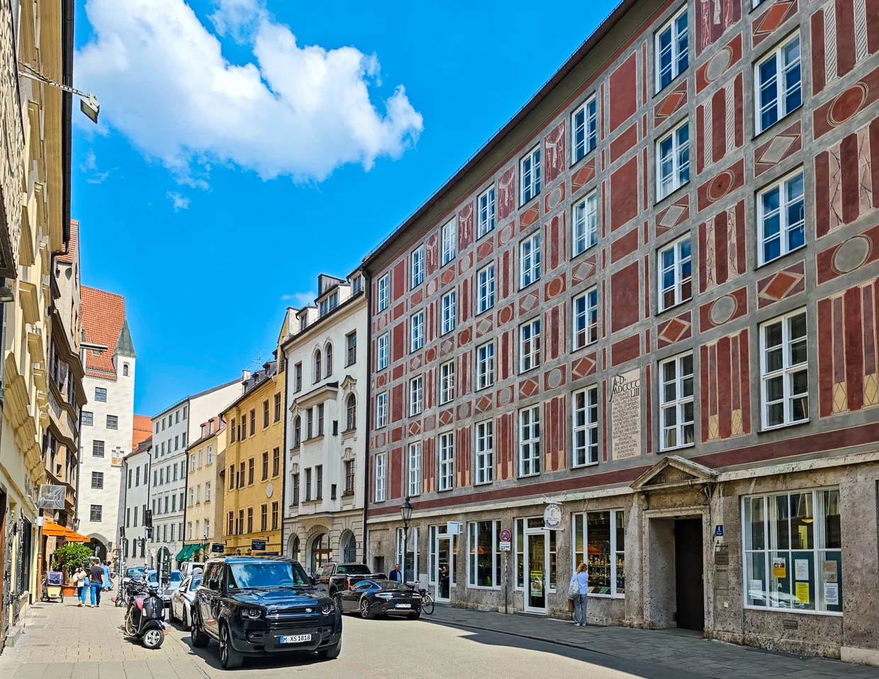 The painted red-and-cream Weinstadl facade on Burgstraße