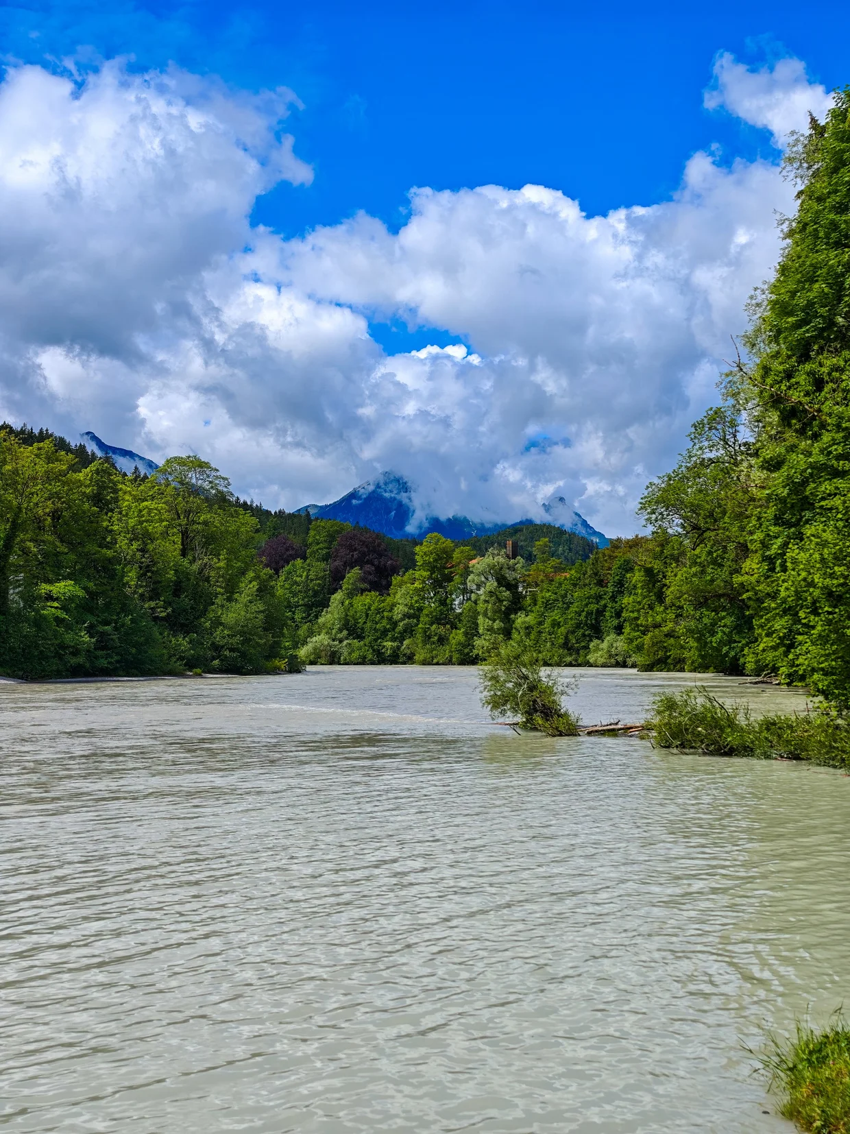 The Lech river running upstream toward the alpine peaks