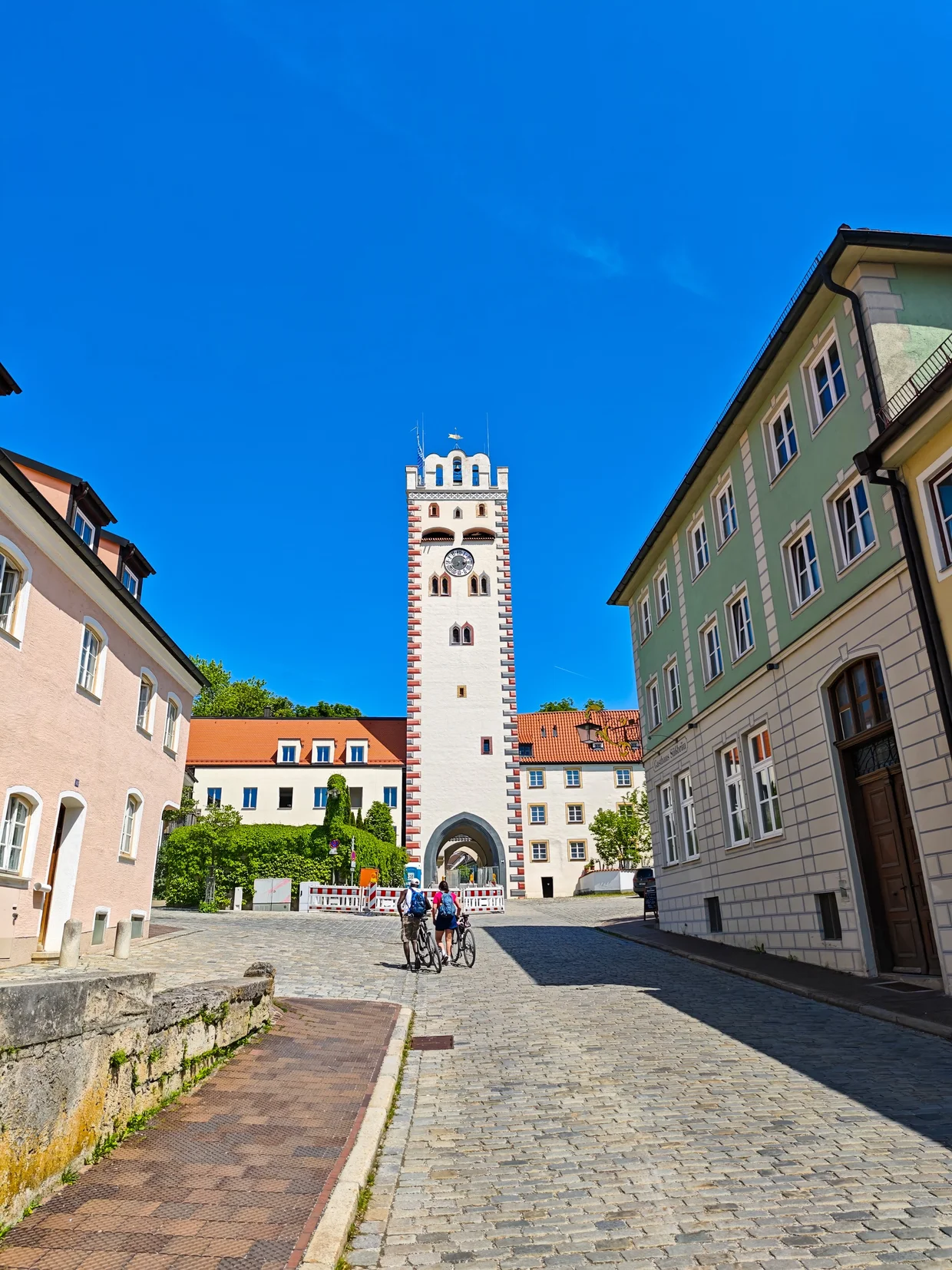 The painted Bayertor with cyclists