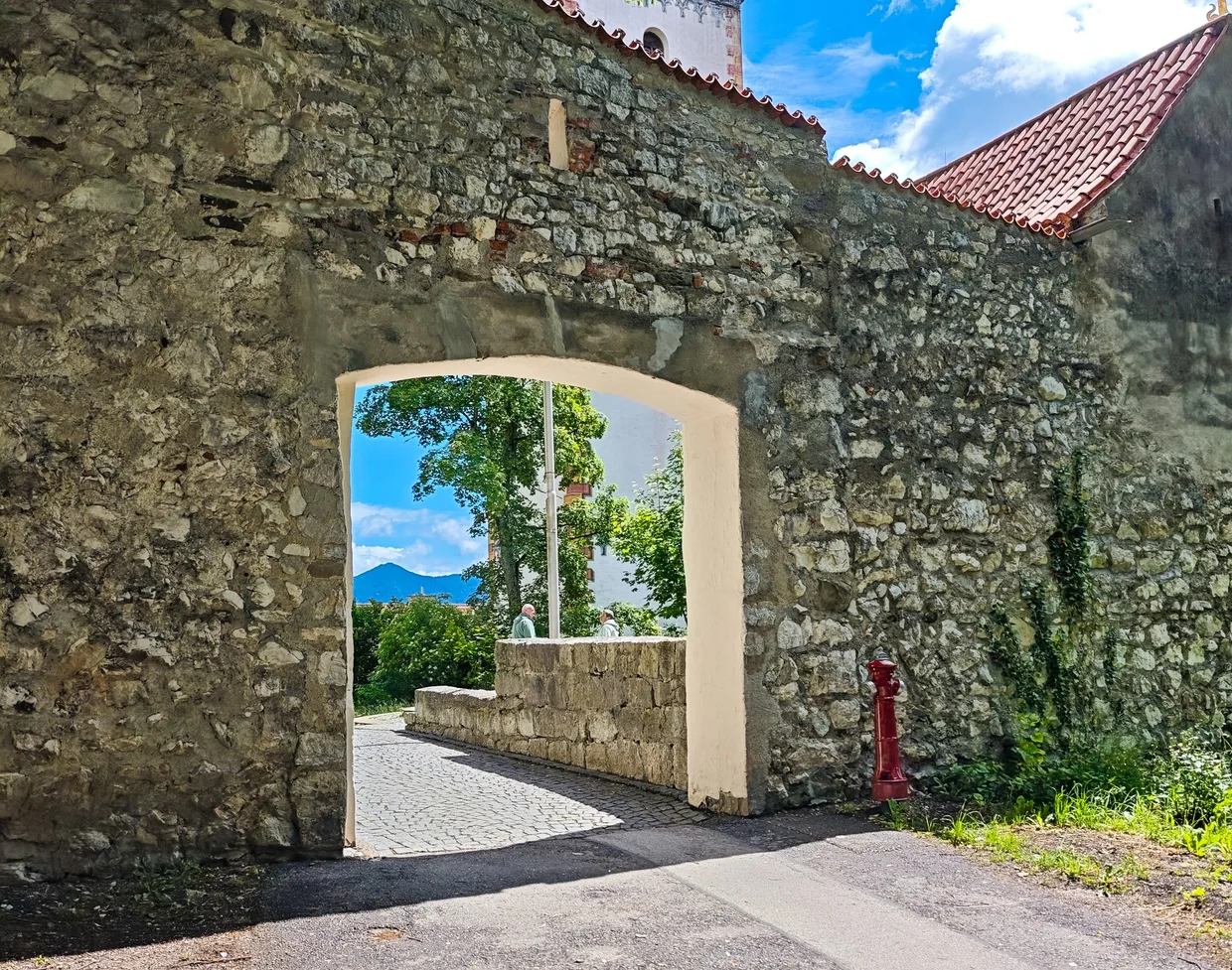 A wall gate framing the mountains beyond