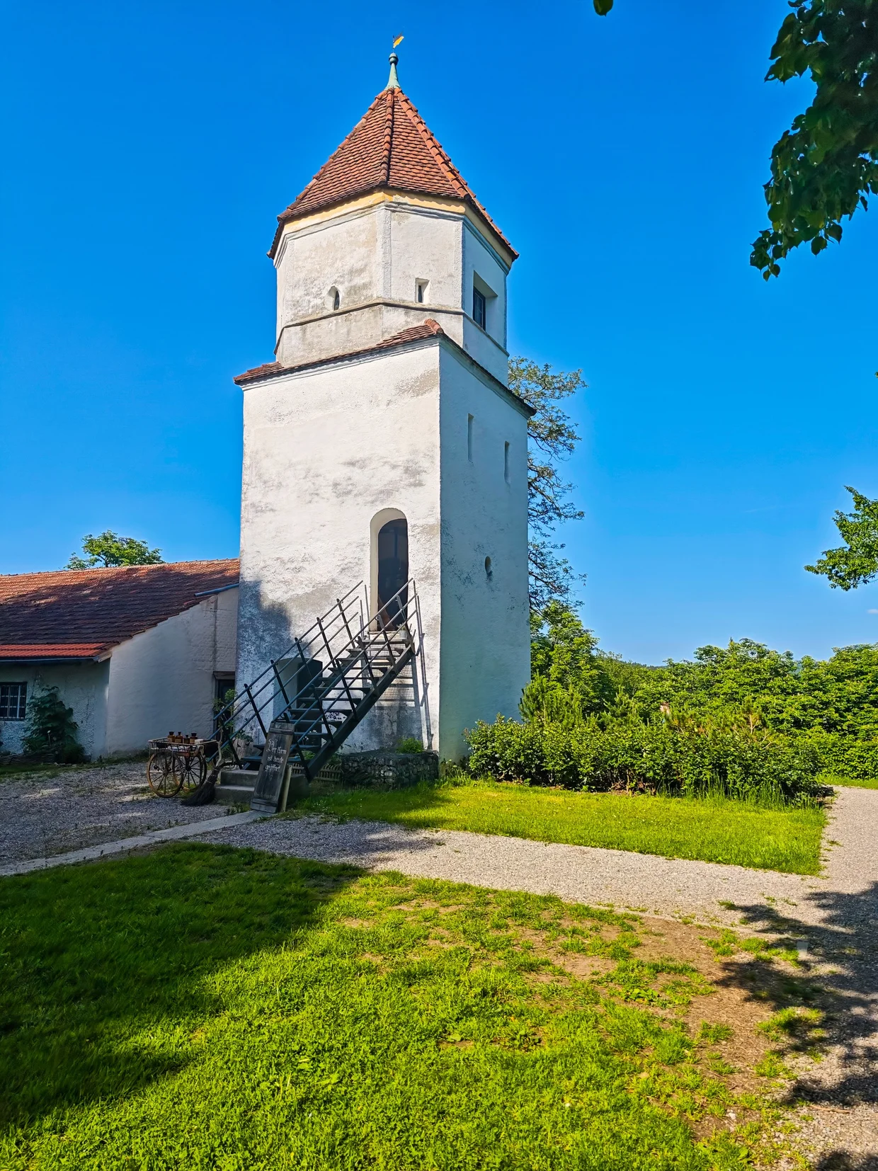 A church tower in a meadow outside the wall