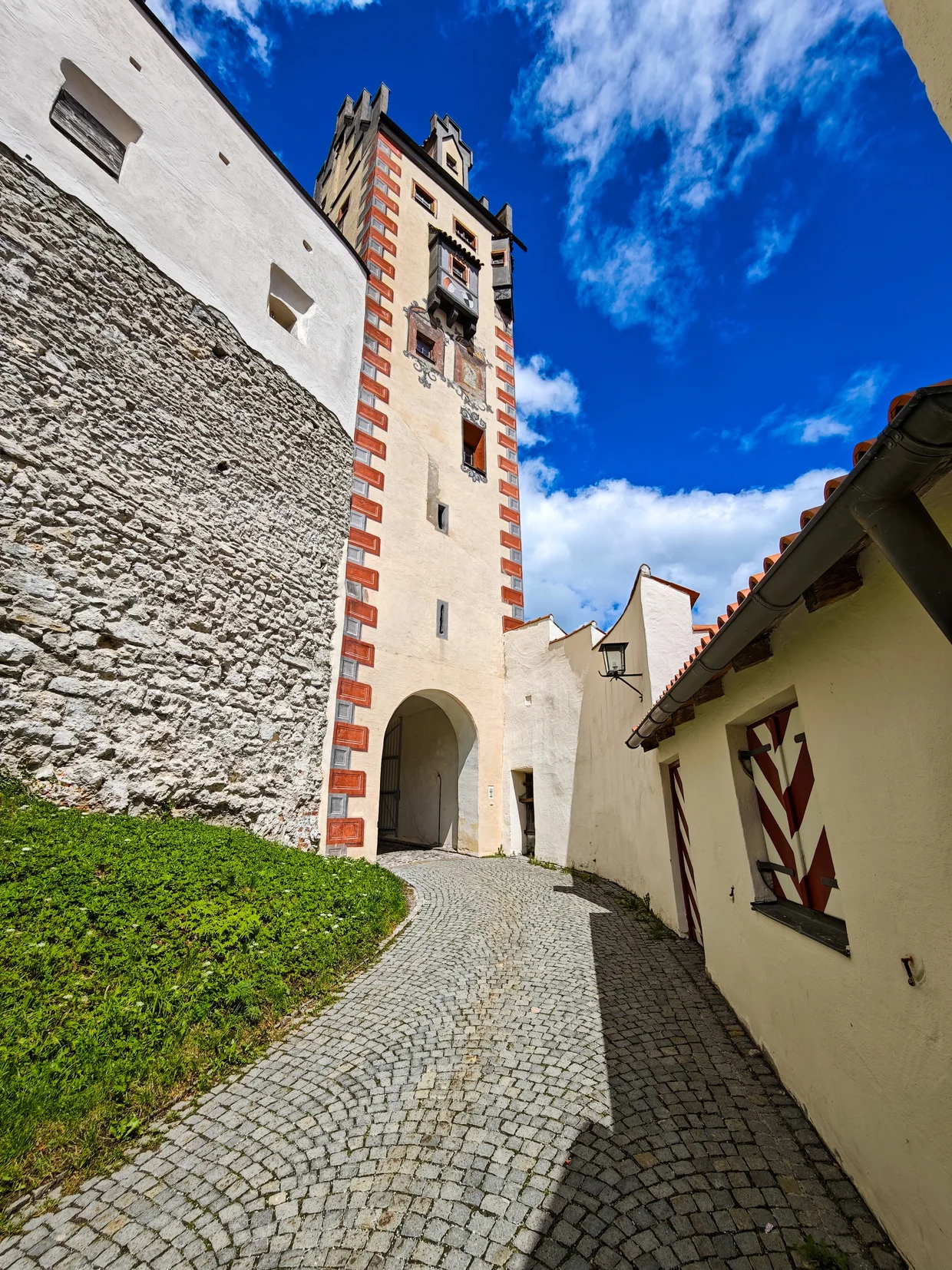 The Hohes Schloss clock tower with its painted trompe-l'oeil stonework