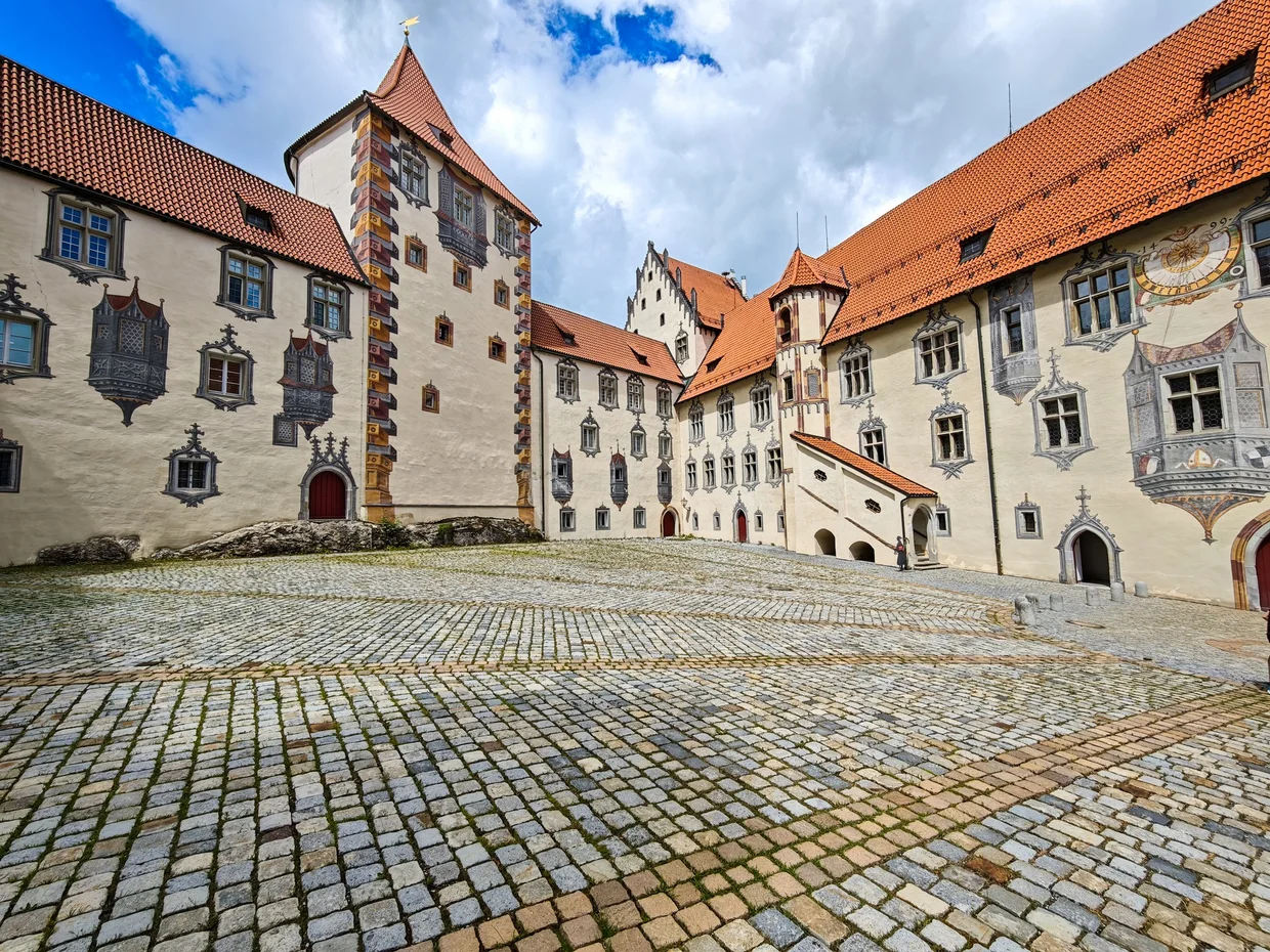 The Hohes Schloss courtyard, where much of the architecture is painted onto flat walls