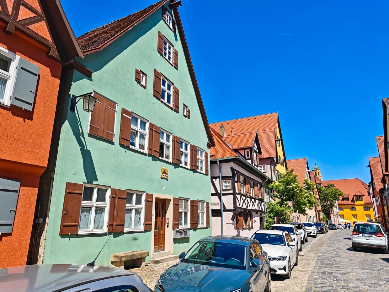 Cobblestone street with half-timbered gables