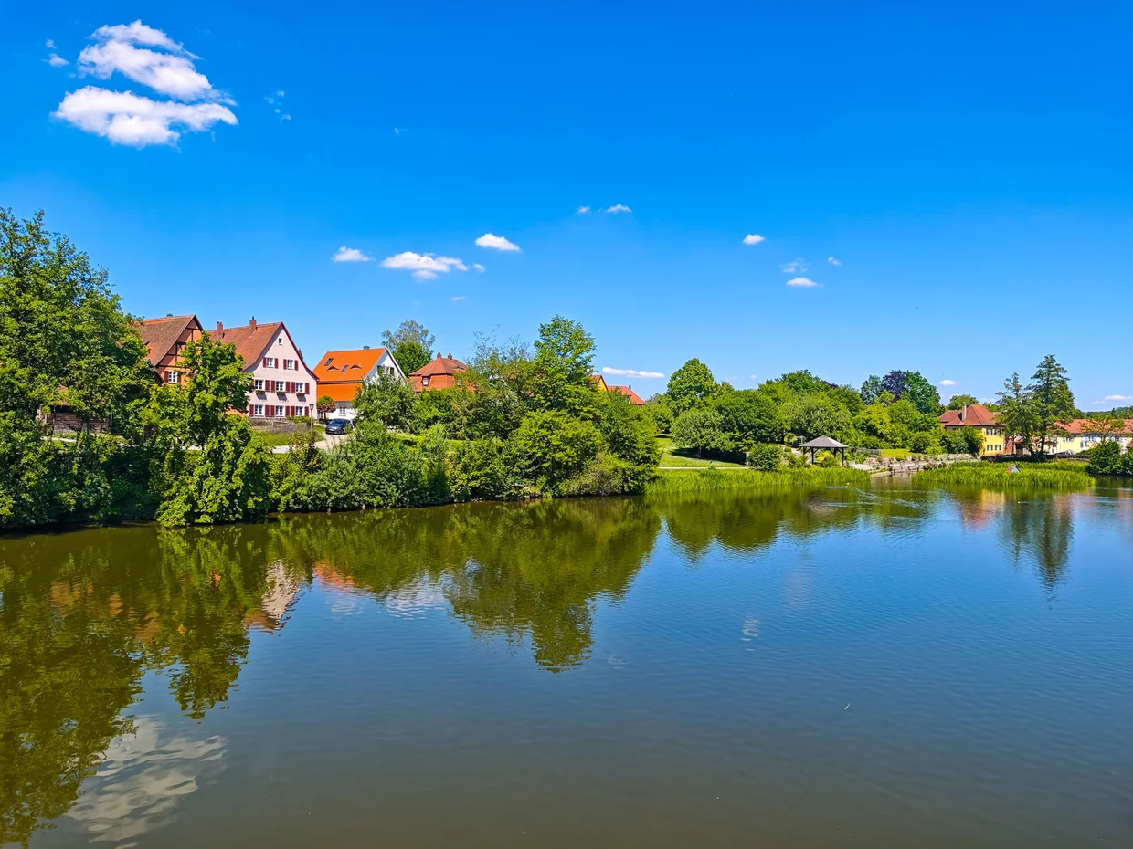 The Wornitz river reflecting the houses