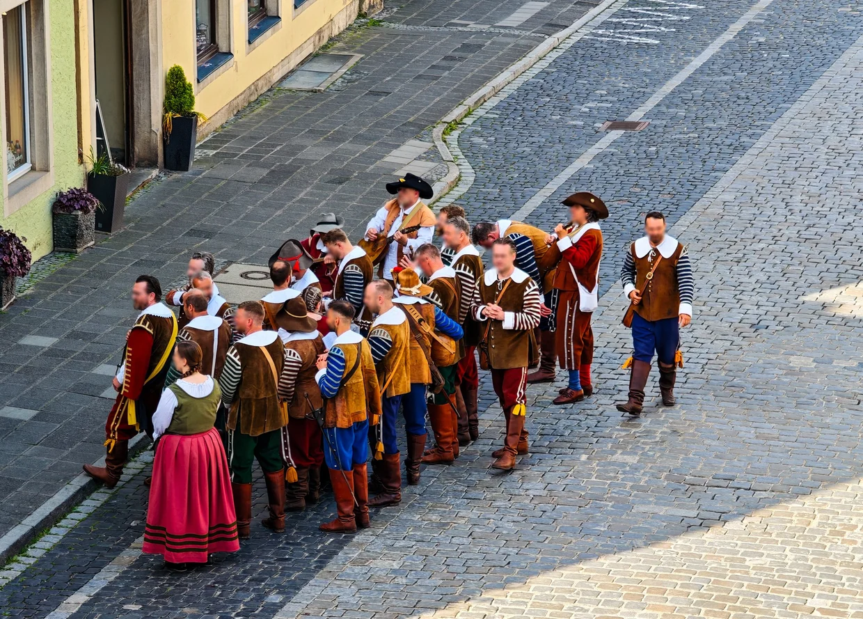 Men in 16th-century costume during the Pfingstfestspiele procession