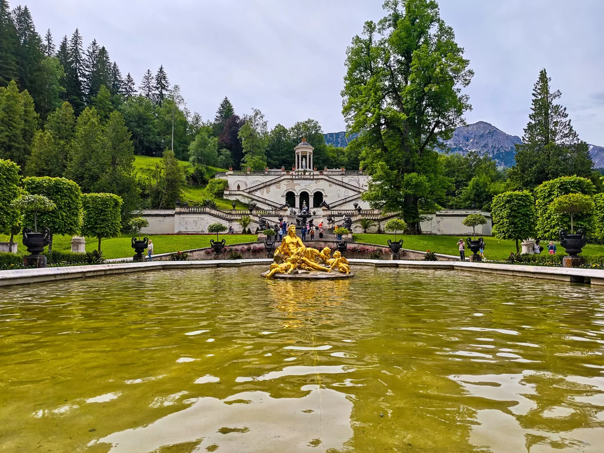 The basin's gilded fountain group with the Music Pavilion on the hill behind