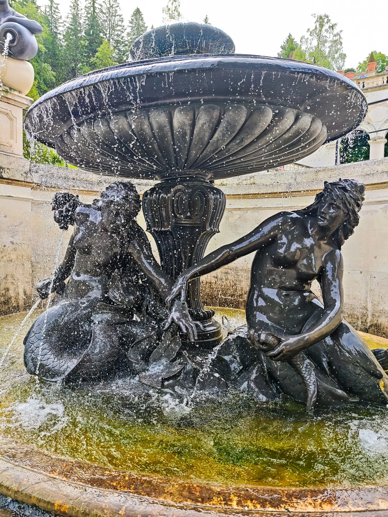 A close-up of the bronze fountain figures and water jets