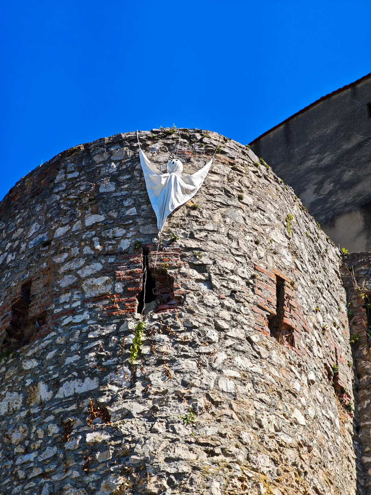 A cheeky ghost figure pinned to the castle wall
