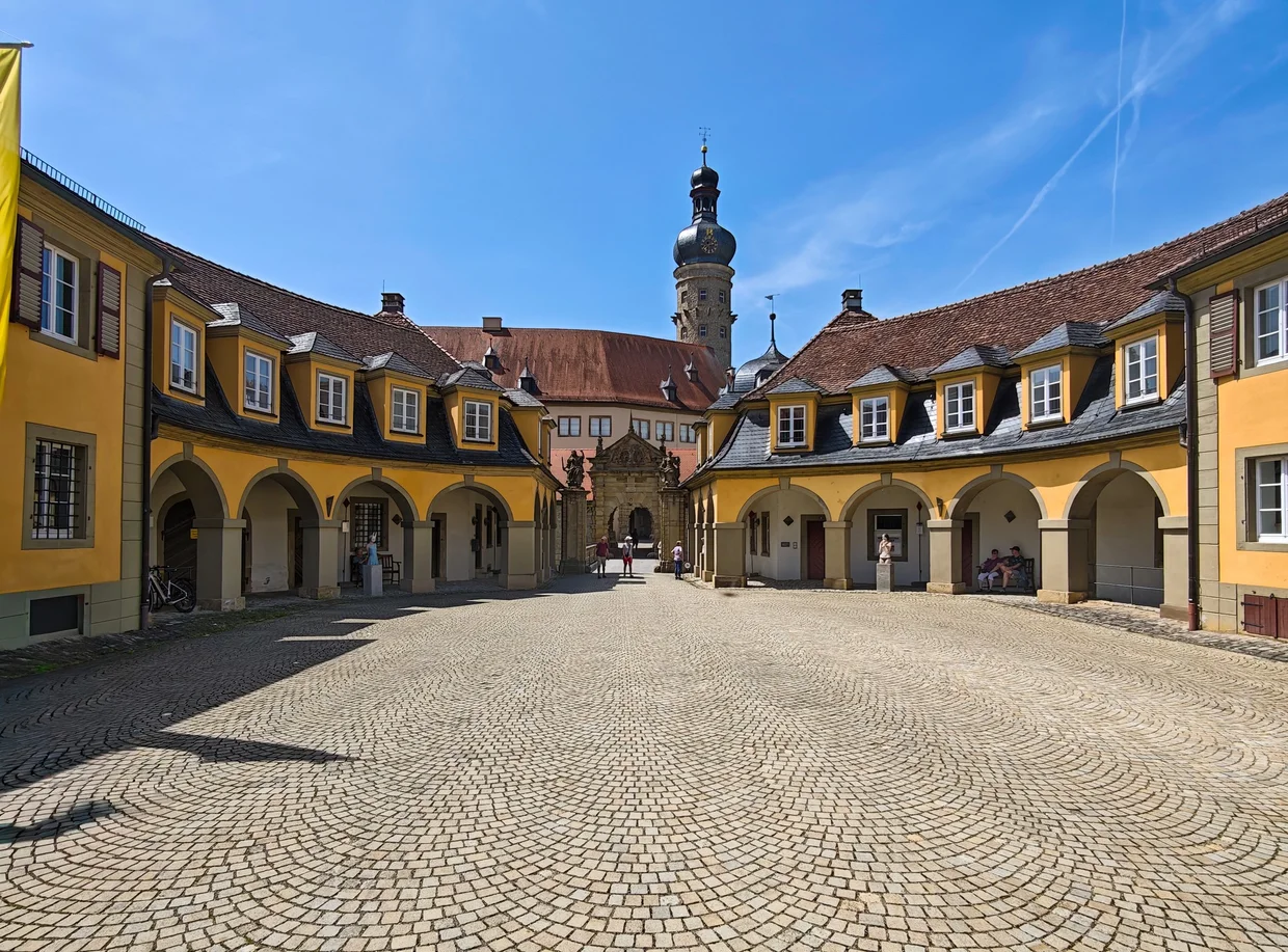 The sandstone entry gate with flanking statues