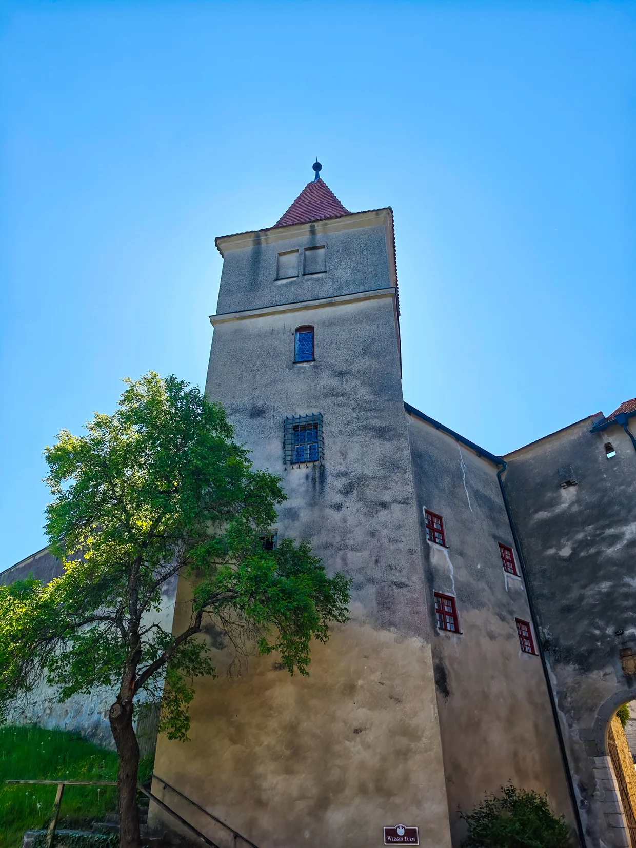 The white square tower against the sky