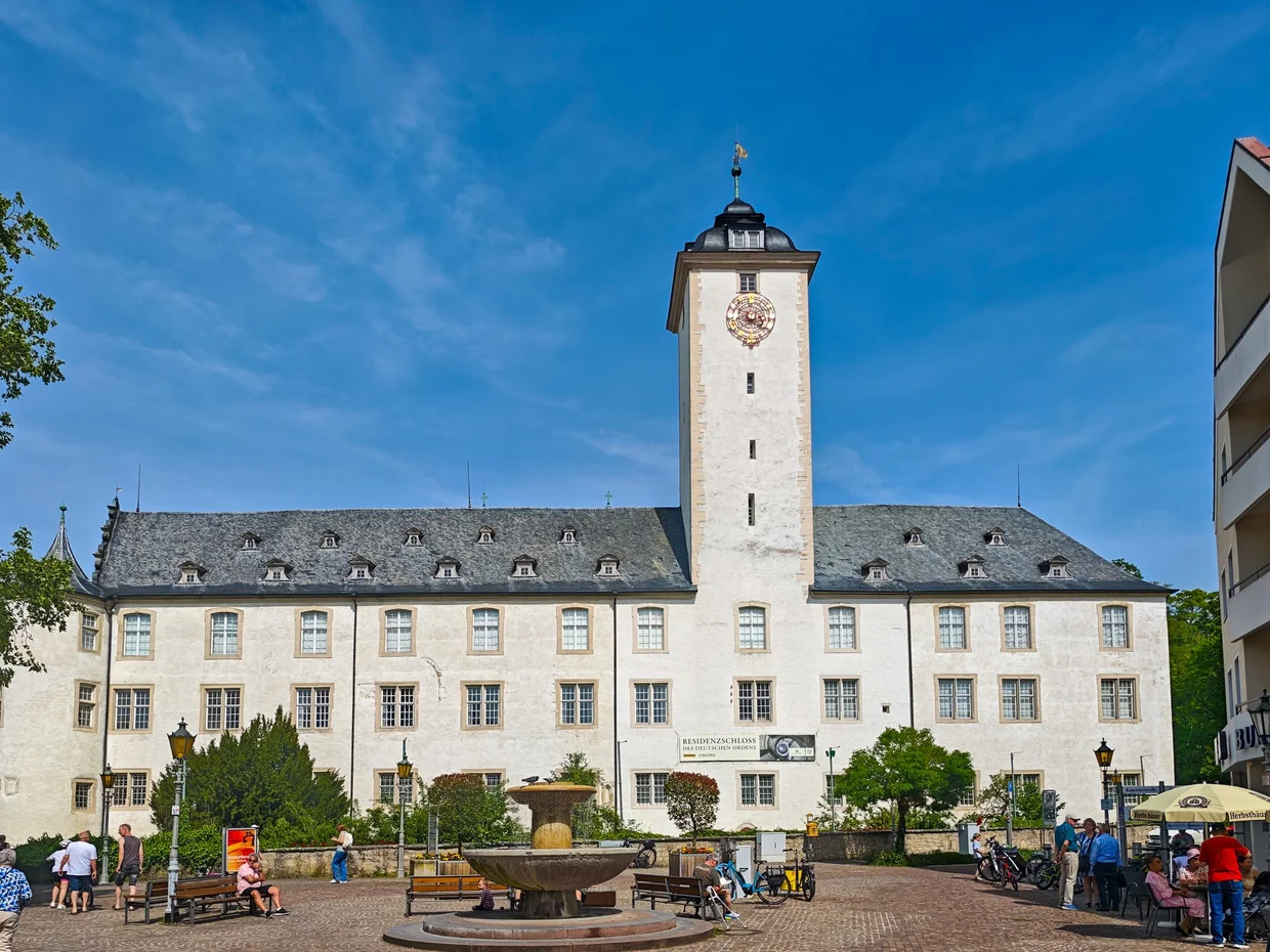 The Deutschordensschloss main facade with central clock tower