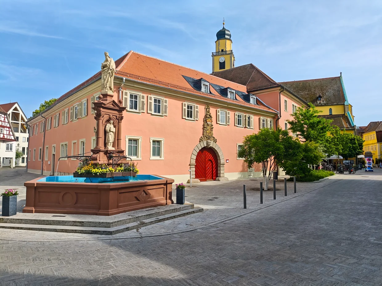Pink Schloss outbuildings with central spire