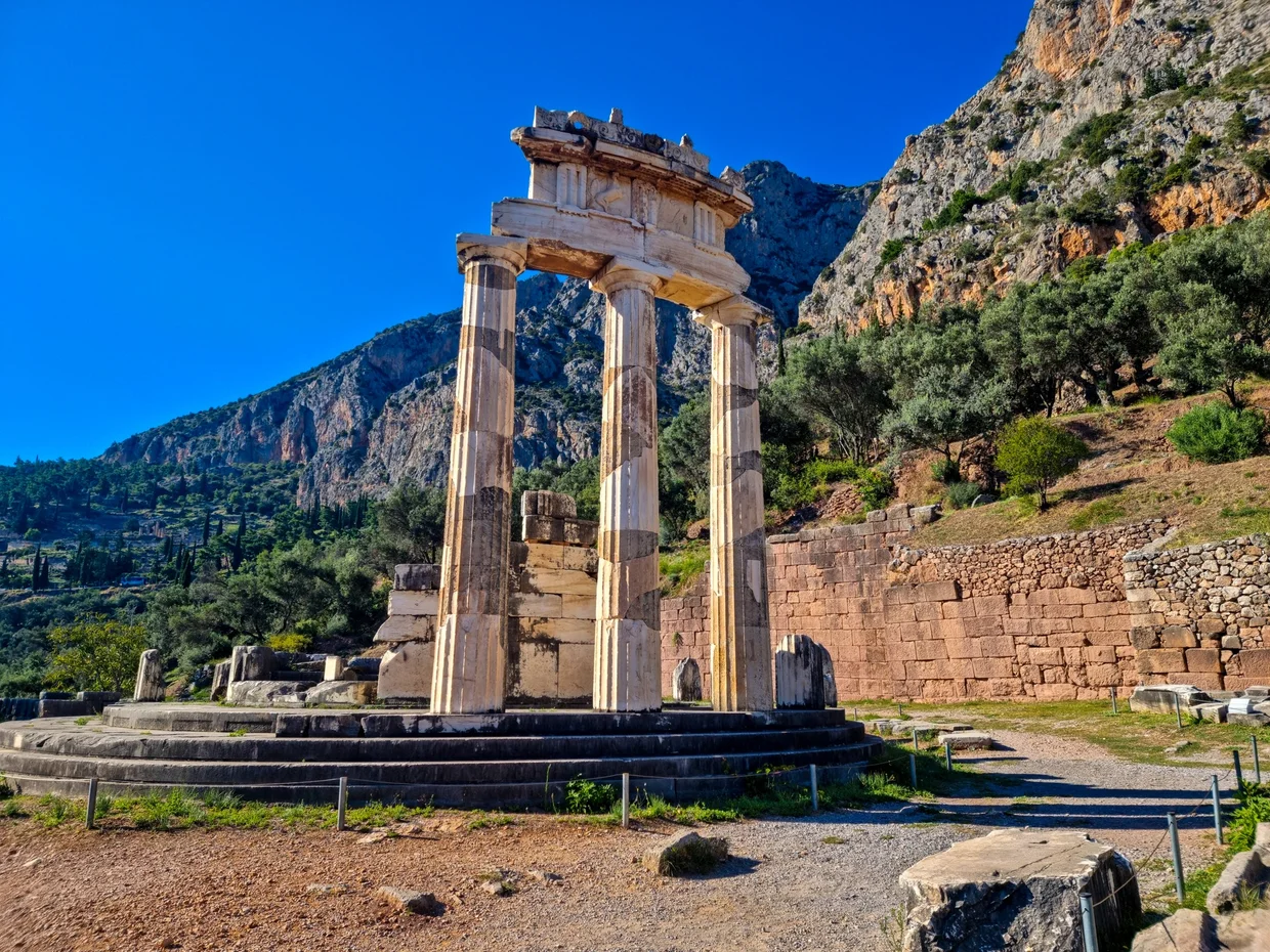 Tholos of Delphi, a circular temple with three reconstructed Doric columns