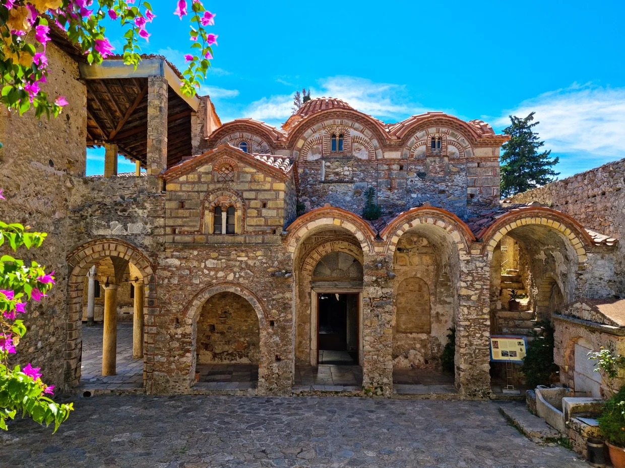 Stone arches and domed buildings of a Byzantine structure at Mystras