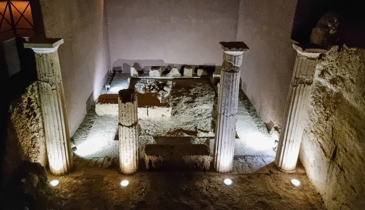 Small Doric-columned shrine illuminated inside the Vergina tumulus