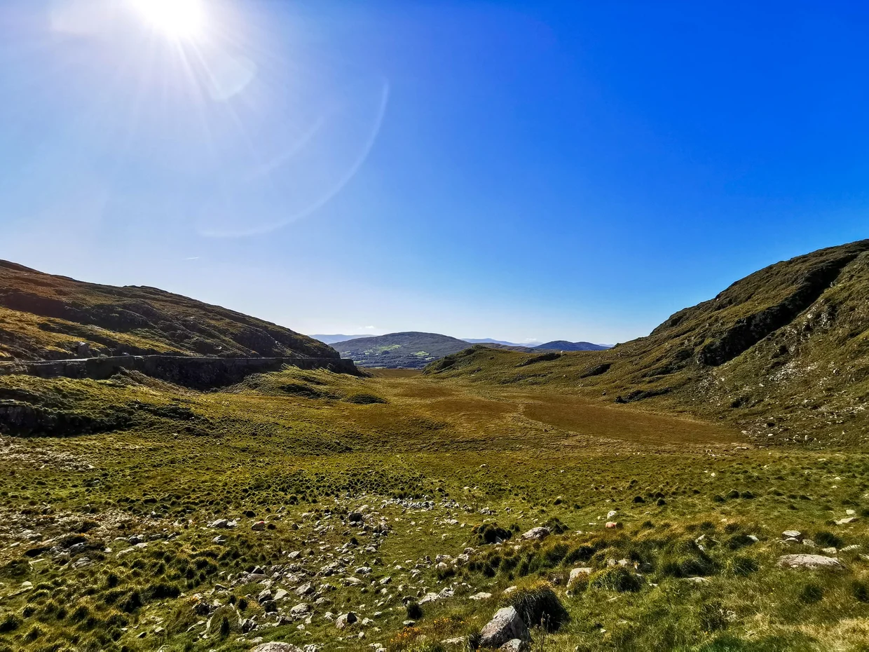 A broad green mountain valley in the Killarney highlands
