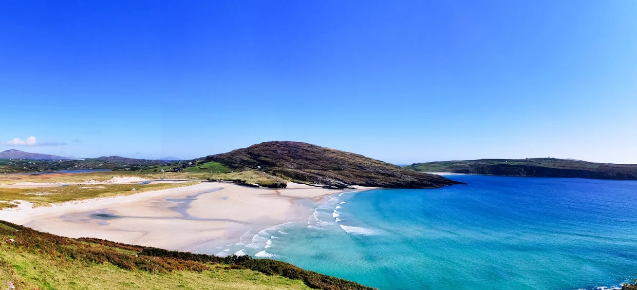 Barleycove beach in West Cork with white sand and turquoise water seen from above
