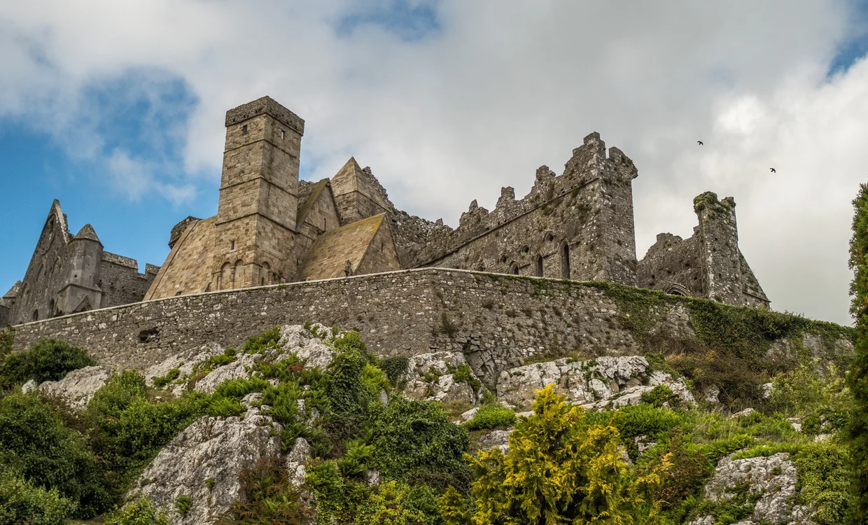 The Rock of Cashel rising from its limestone hilltop seen from below