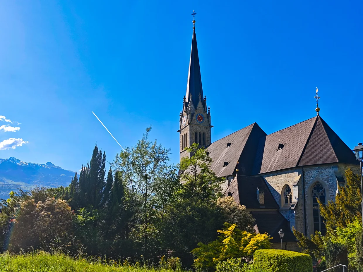 Same building from the side, with mountains in the gap
