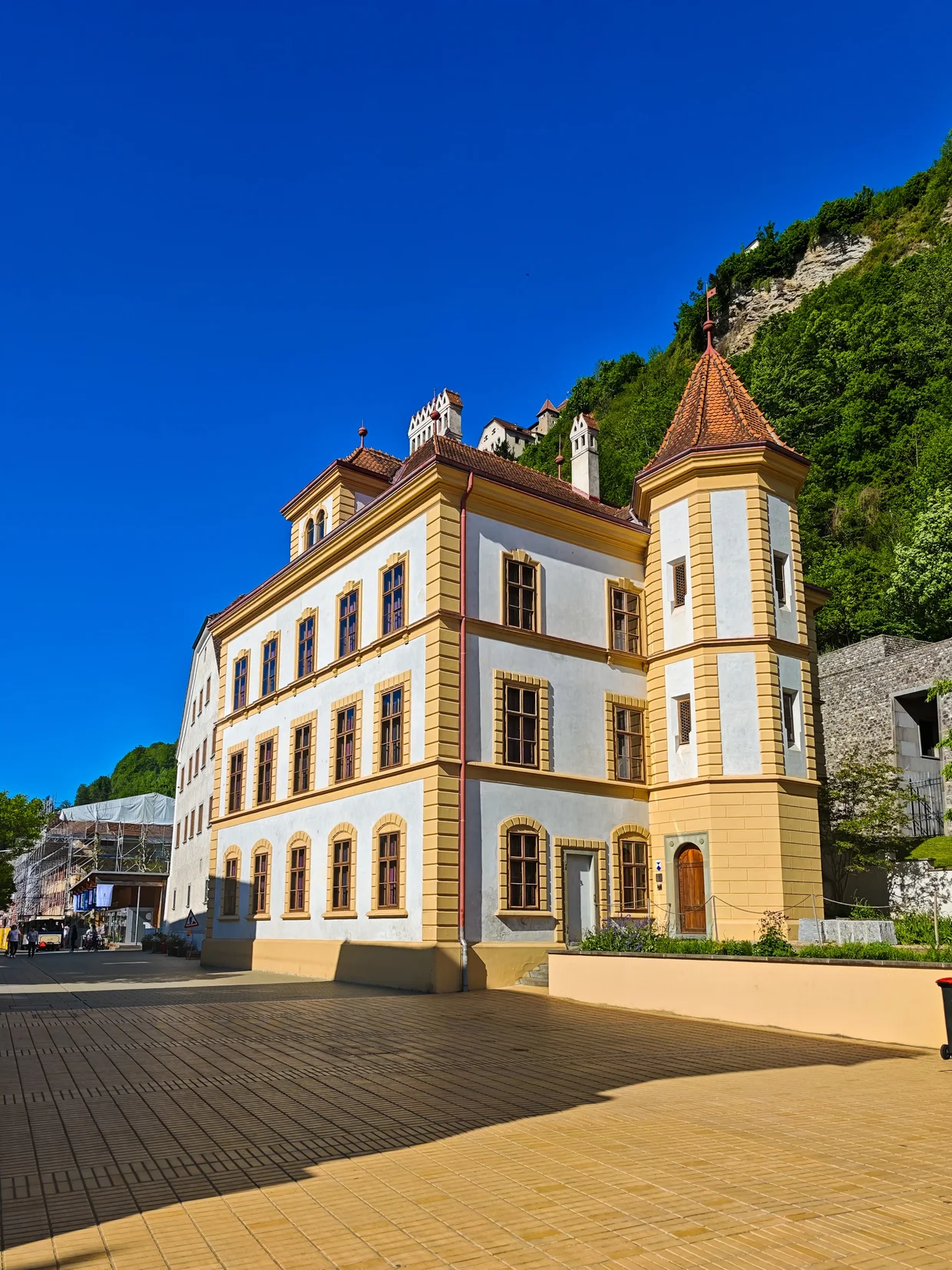 Quiet downtown alley with the Vaduzer Saal tower