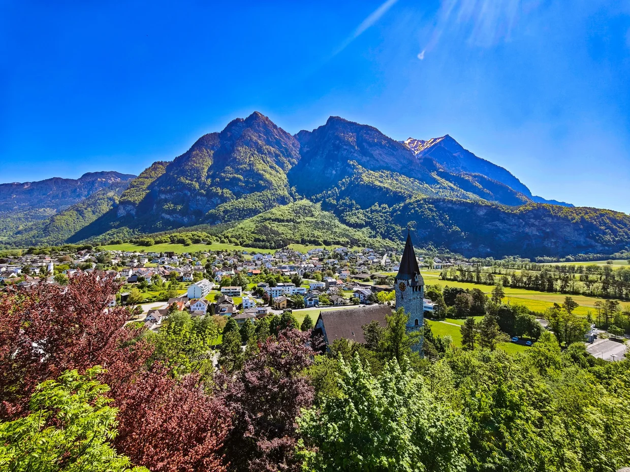 The Balzers village with its church and a backdrop of mountains