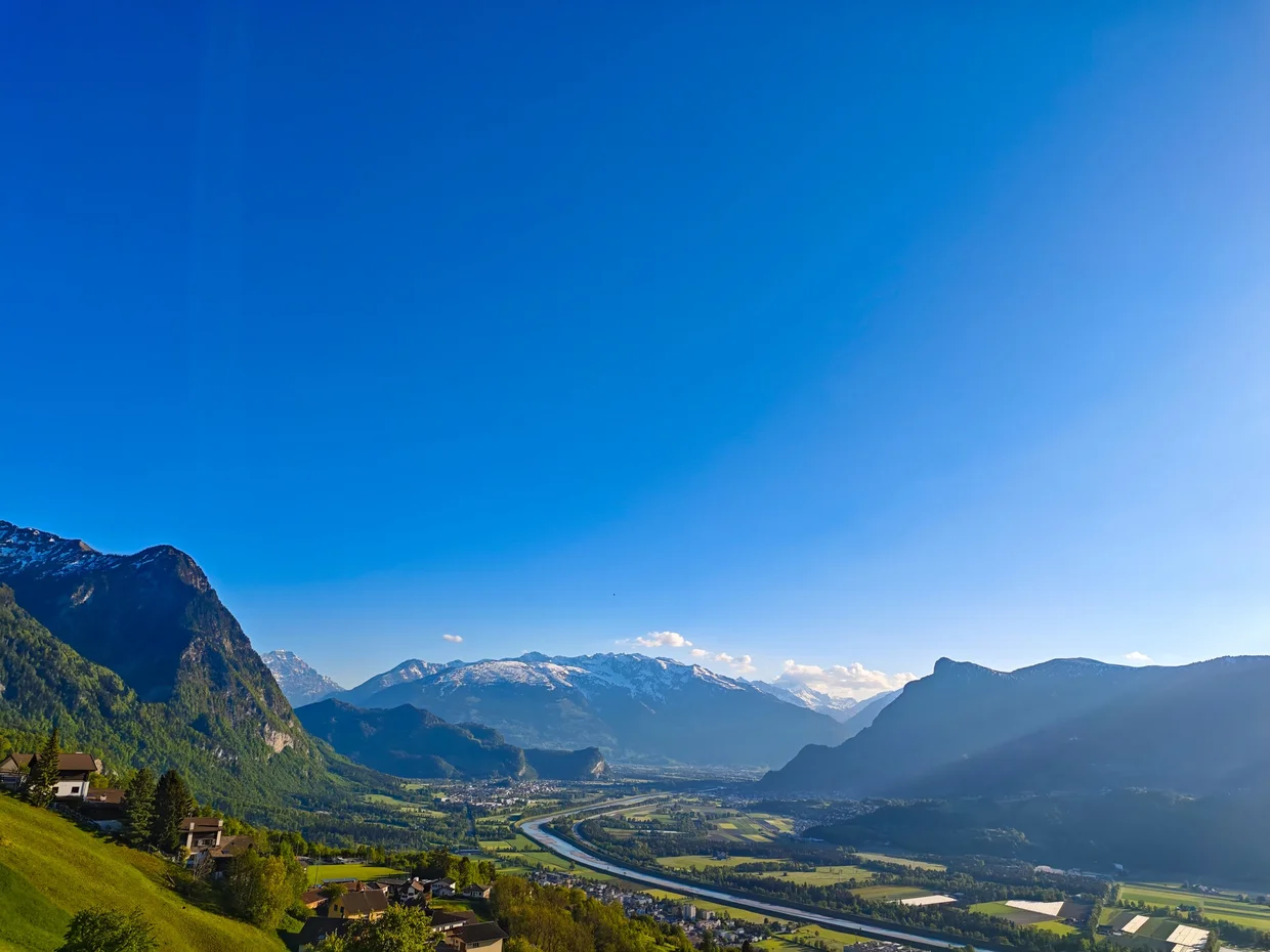 Same view in evening light, the Alps catching the last sun