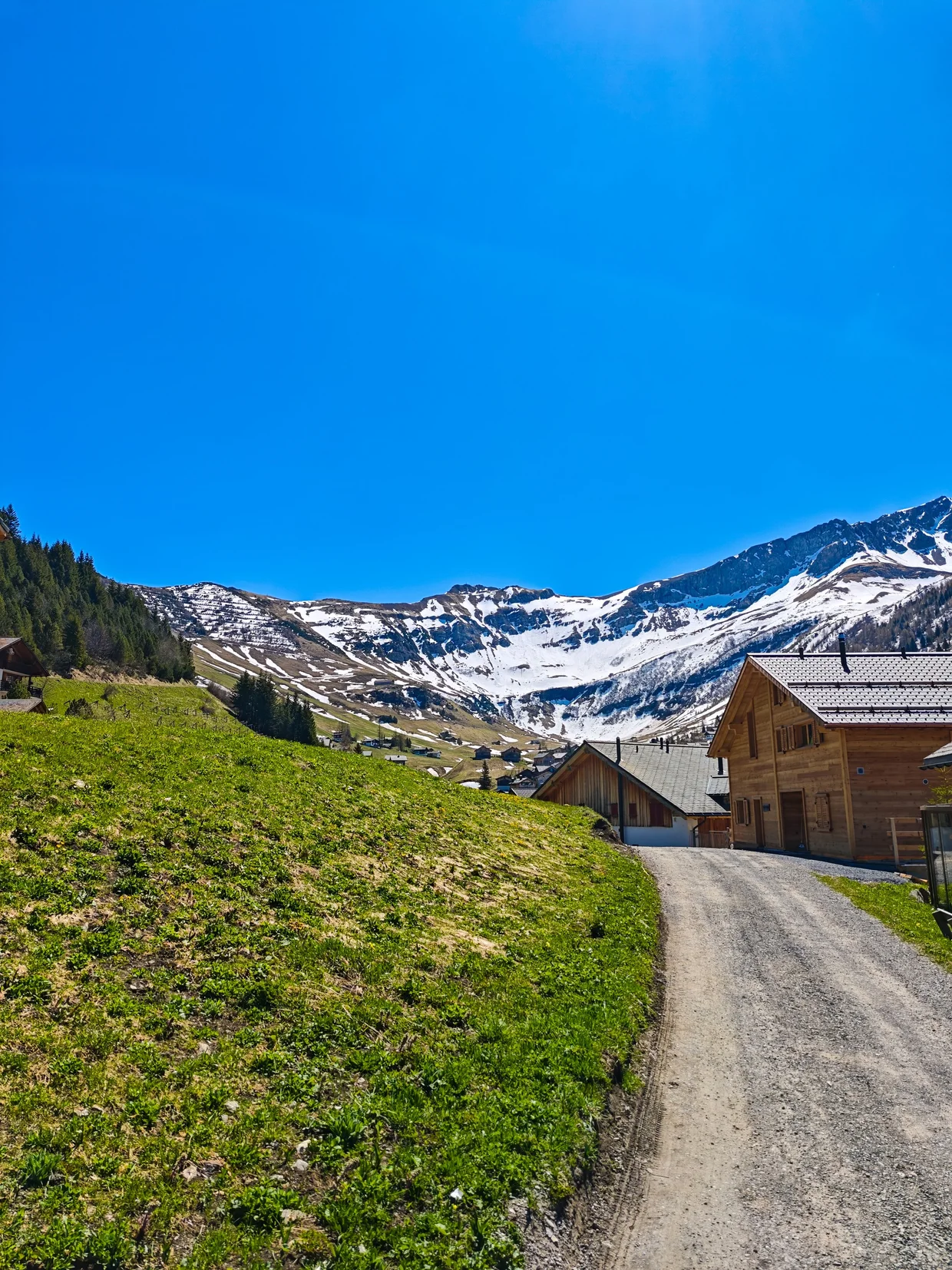 Path through Malbun's wooden houses