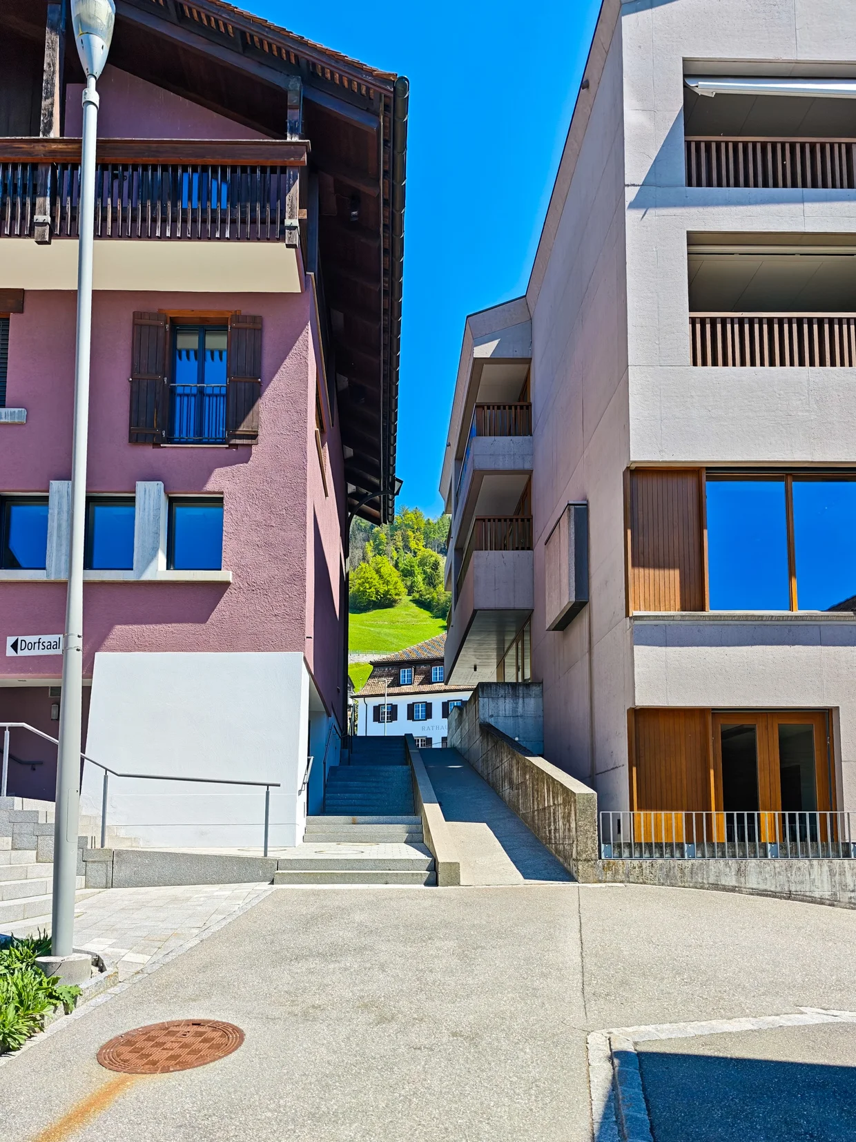 A street corner where old timbered houses meet new architecture