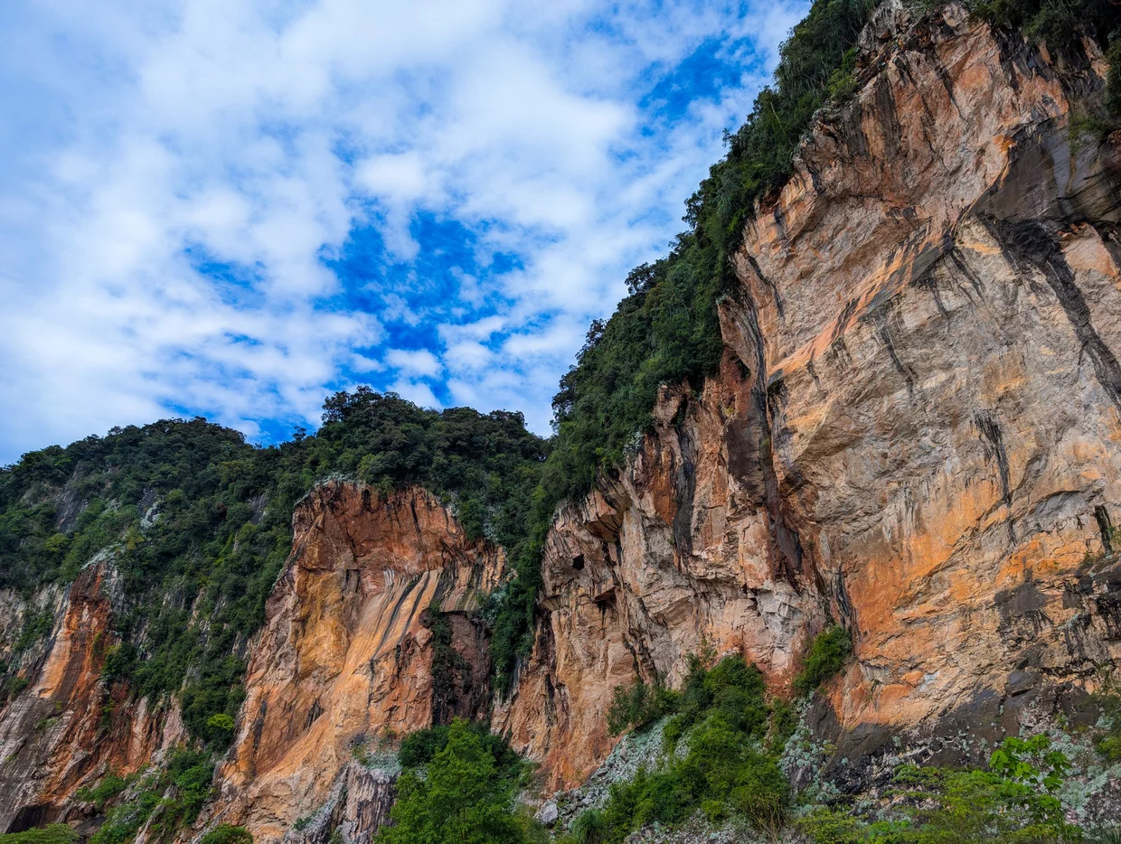Limestone cliff face from below