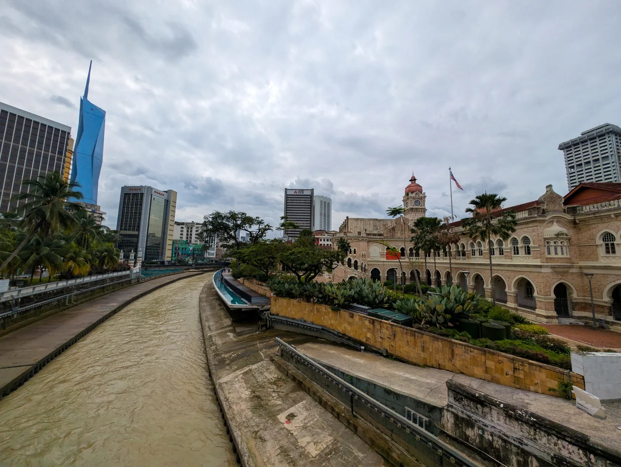 River of Life running past the colonial buildings