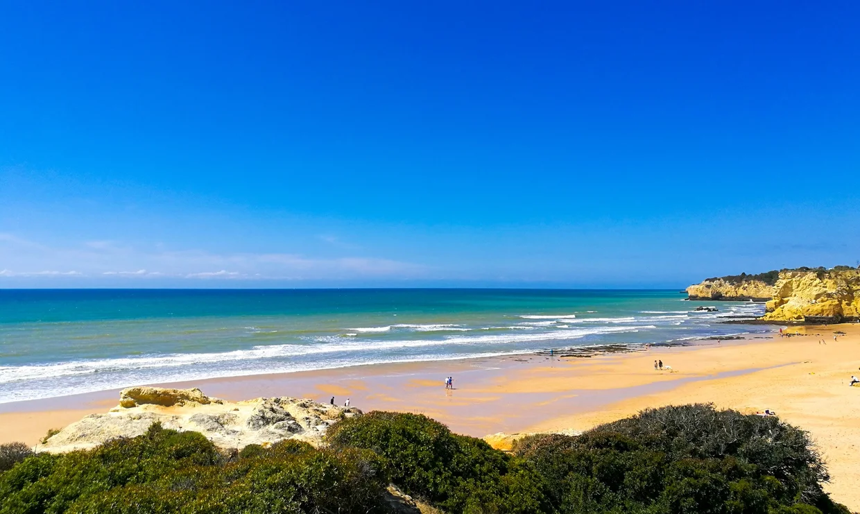 Algarve beach with turquoise water and golden sandstone cliffs