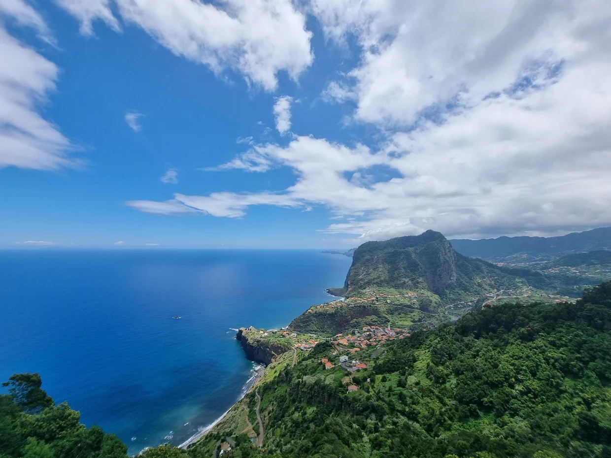 Dramatic green cliffs and coastline of Madeira with the Atlantic below