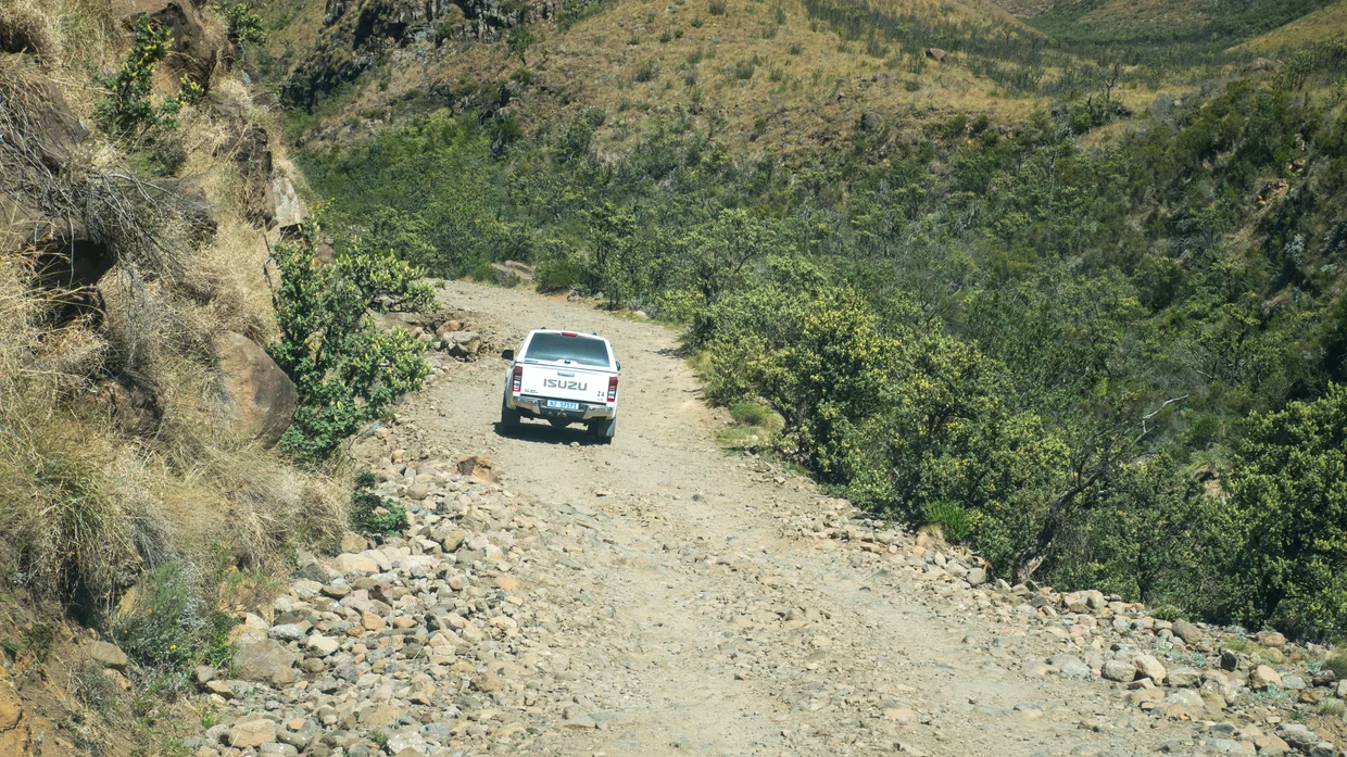 A 4x4 navigating a rough mountain track