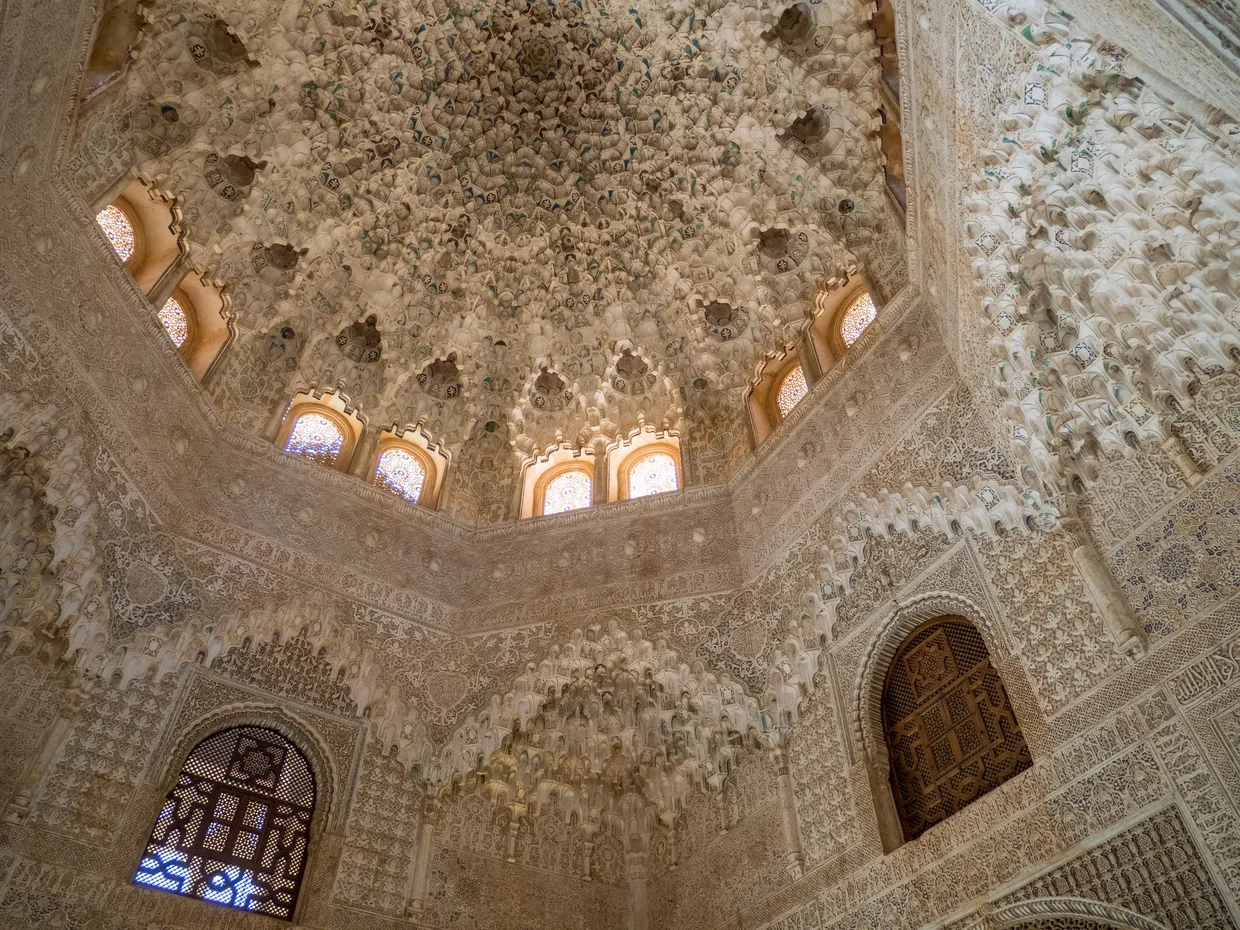 The muqarnas dome with stained glass windows below