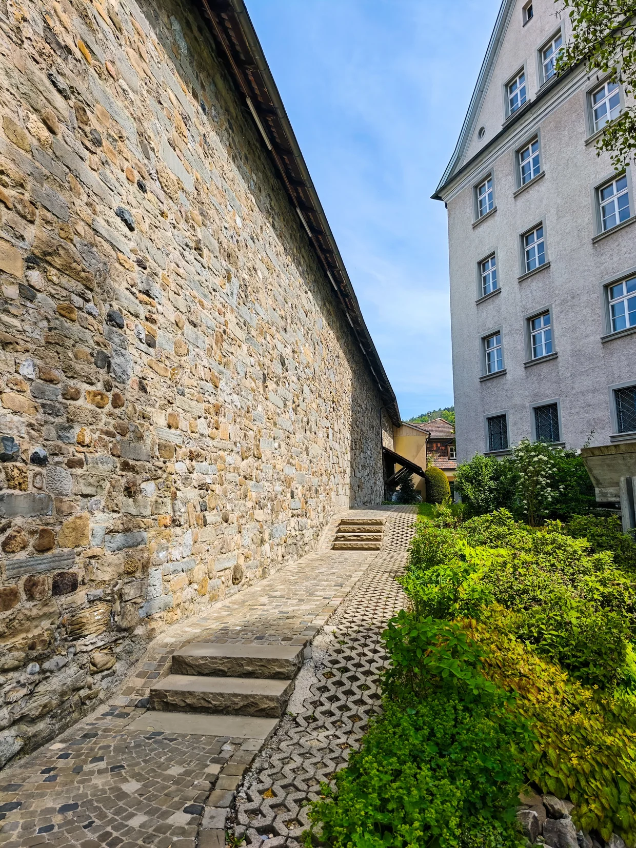 Stone wall and cobbled path alongside the old abbey wall