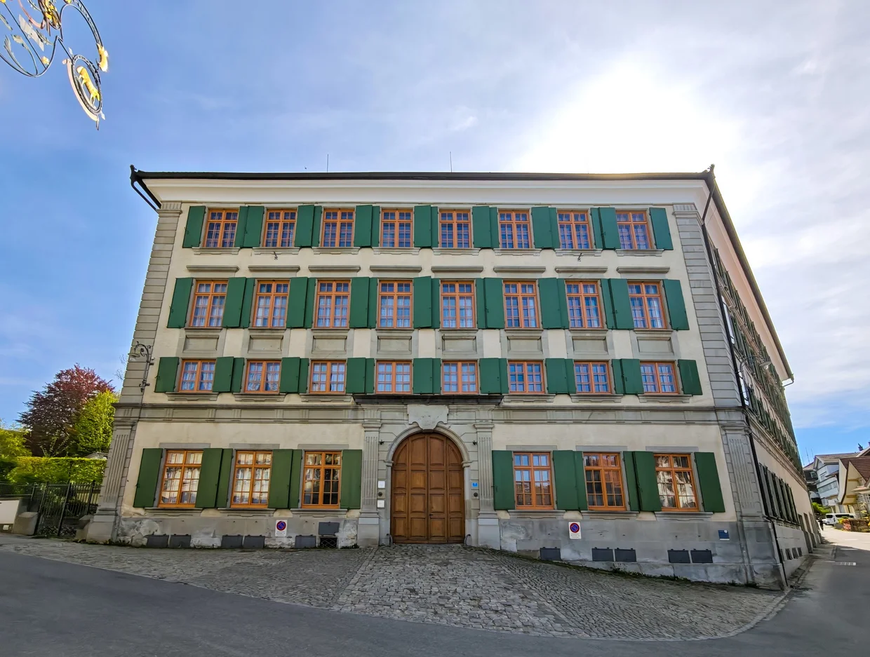 A green-shuttered townhouse on a quiet corner of Trogen