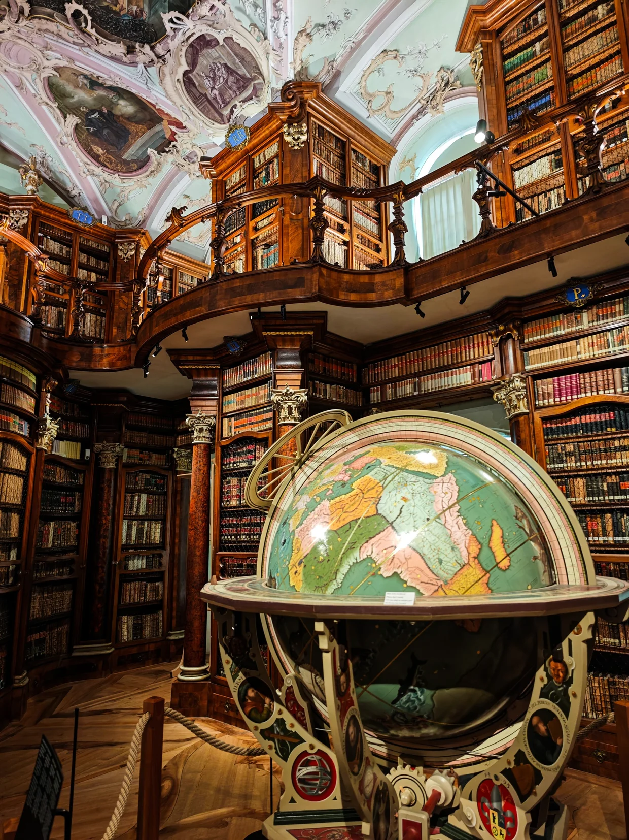 The ornate 16th-century globe in the middle of the library hall