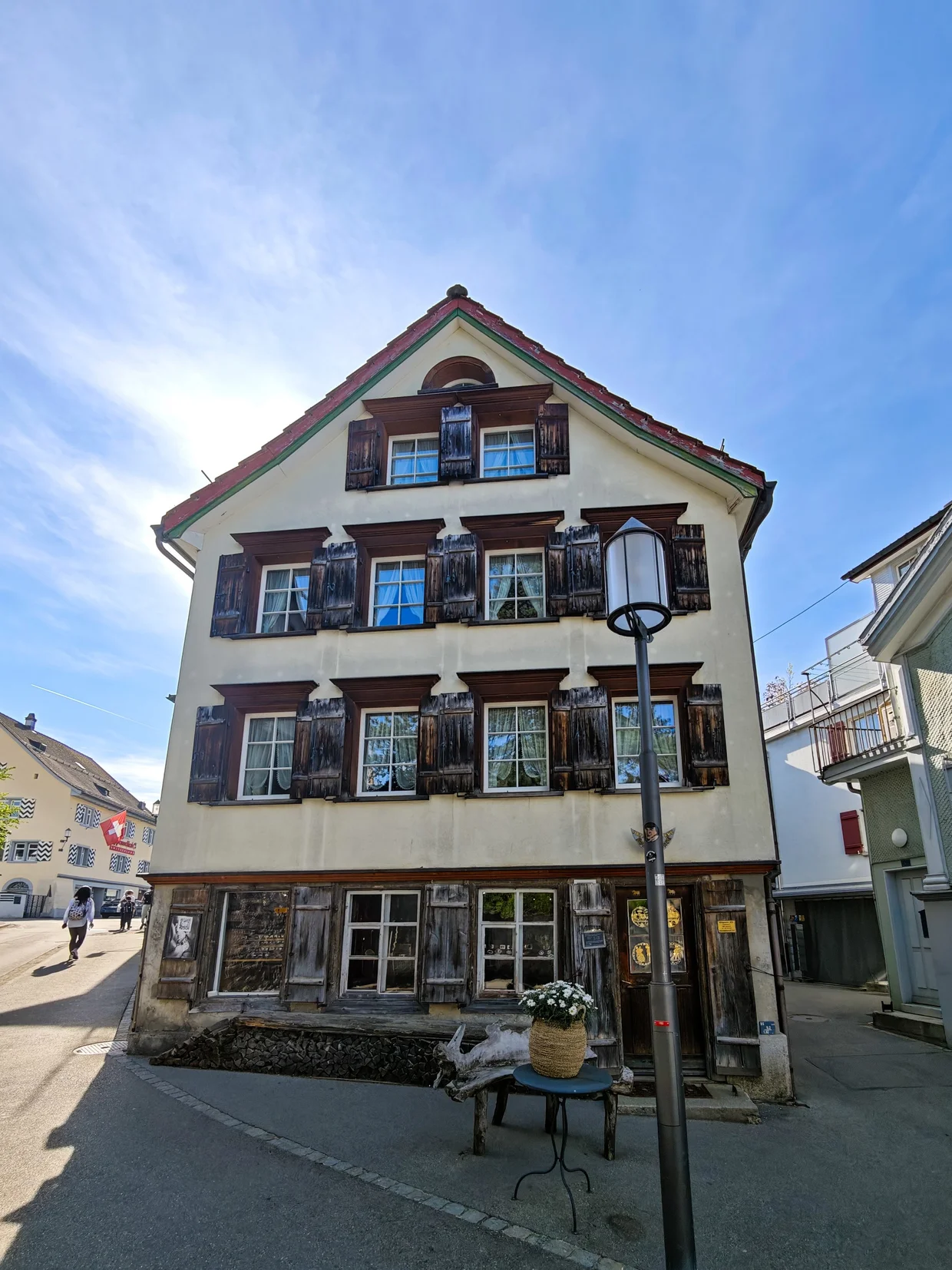Older wooden-shuttered traditional Appenzeller house on a side street