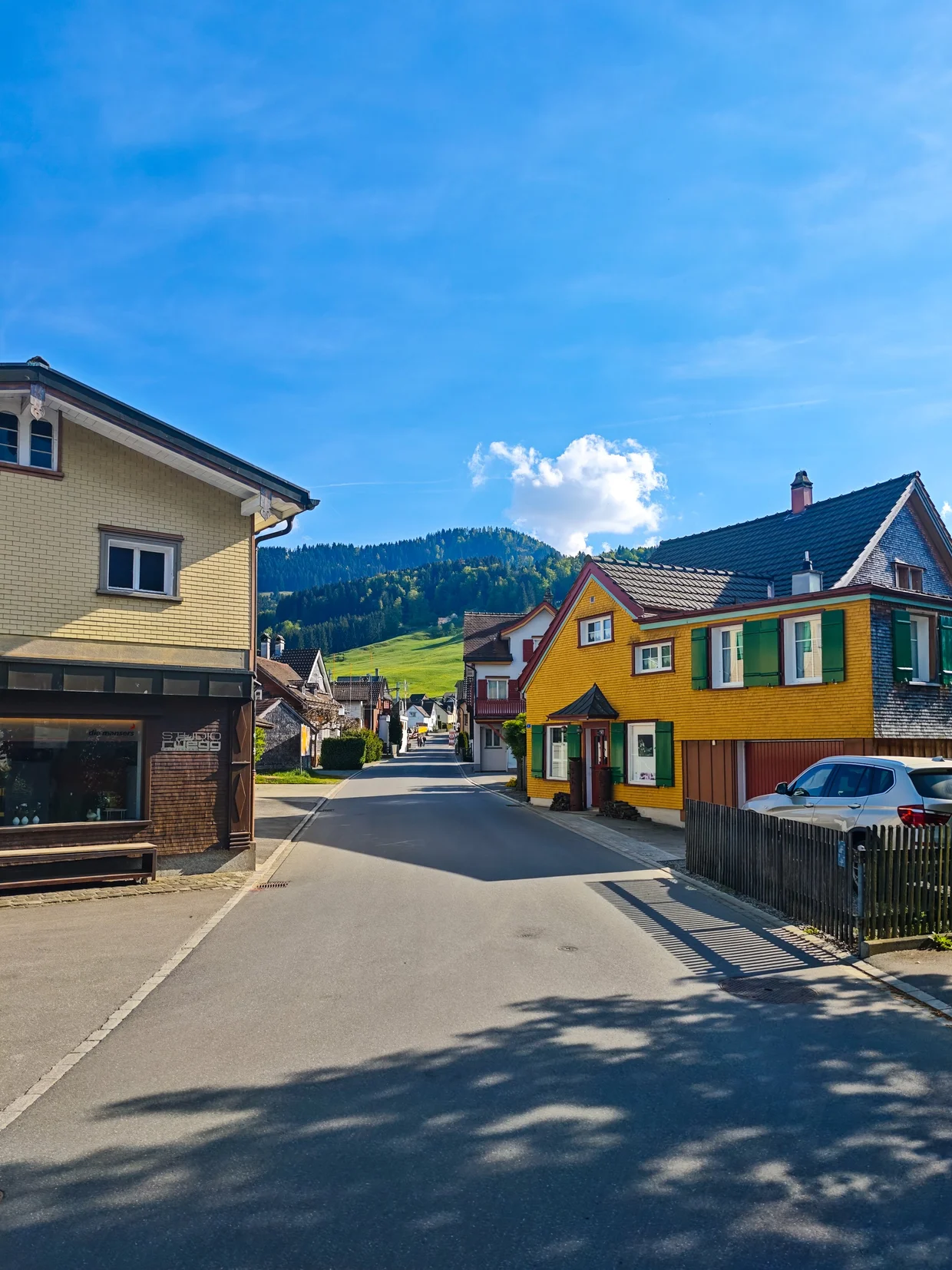 Quiet residential street toward the edge of the village